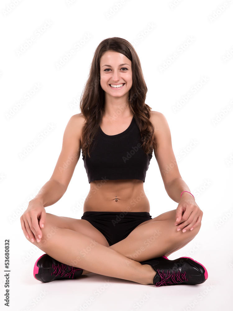Beautiful young fitness woman isolated