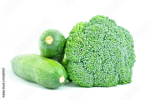 Healthy food - broccoli and zucchinis on white background