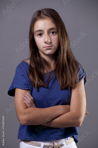 Young brunette girl, looking very unhappy or sad