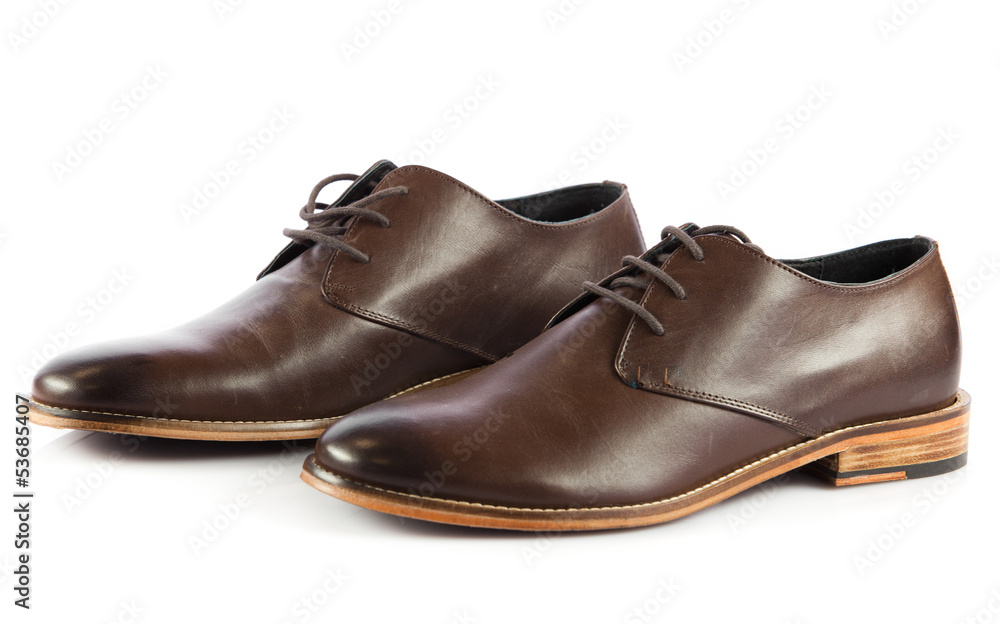 Brown man's shoes isolated on white background. Pair of brown m Brown man's shoes isolated on white background. Pair of brown m