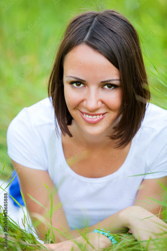 Beautiful teen girl in the park at green grass. Beautiful teen girl in the park at green grass.