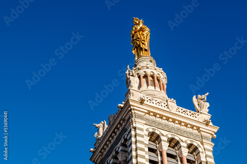 Golden Statue of the Madonna Holding the little Jesus on the top