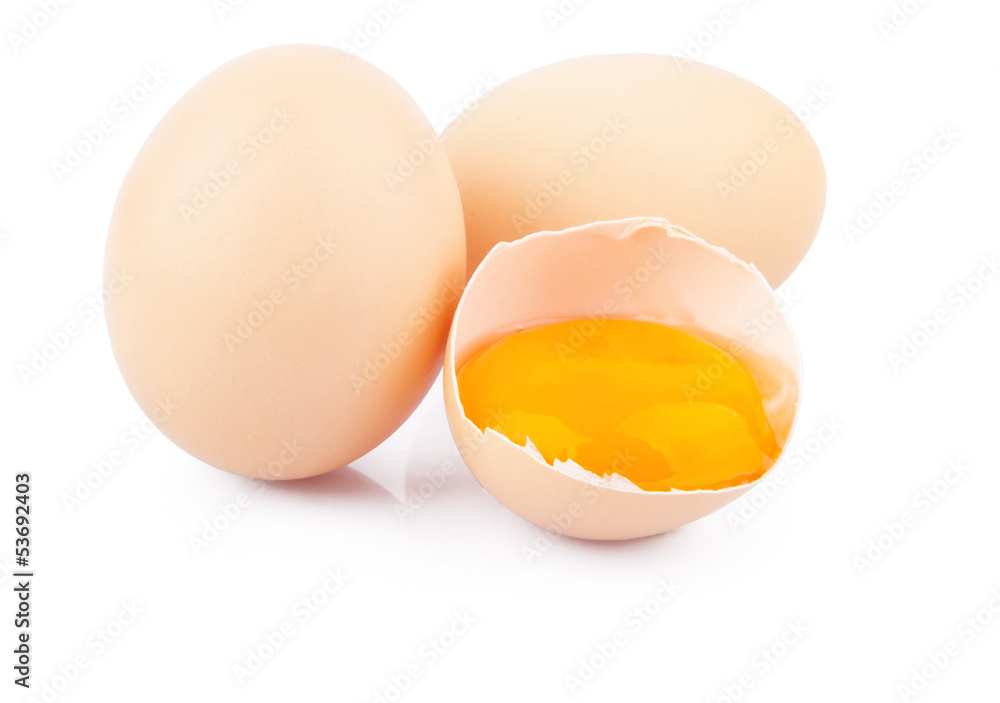 Chicken raw eggs, whole and broken on white, food photo Chicken raw eggs, whole and broken on white, food photo