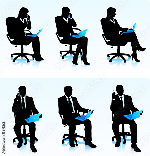 Businesswomen and businessmen with laptops