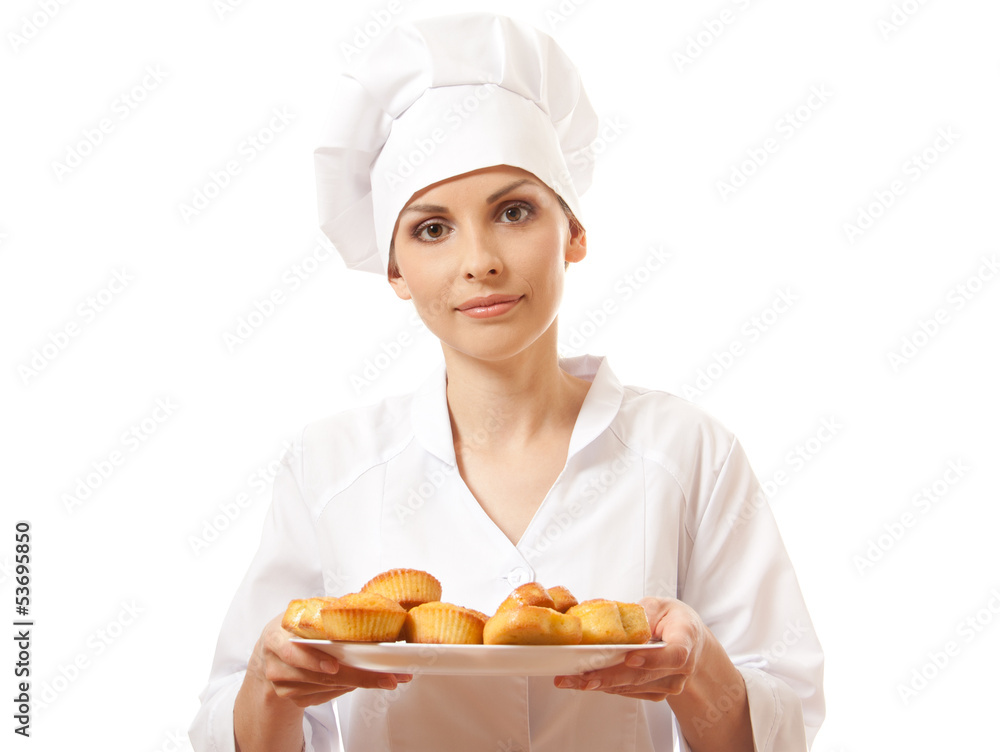 Woman chef in uniform holding tray of cookies. Woman chef in uniform holding tray of cookies.