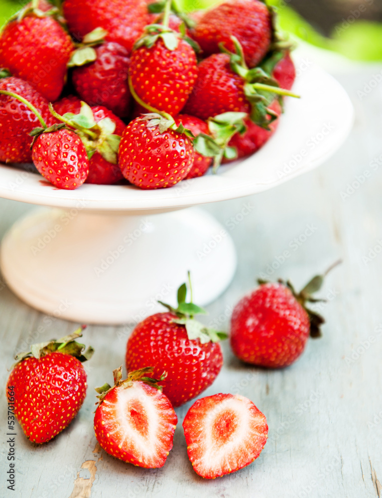 strawberry on a plate in the garden strawberry on a plate in the garden
