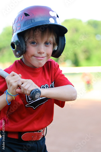 Canvas Print Happy baseball boy in helmet up close.