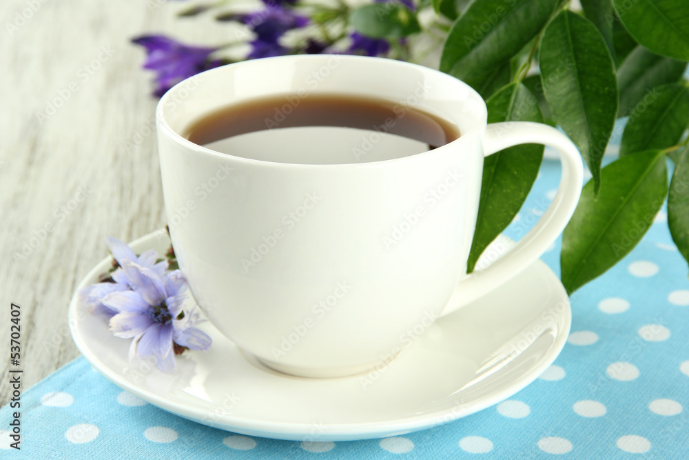 Fototapeta premium Cup of tea with chicory, on wooden background