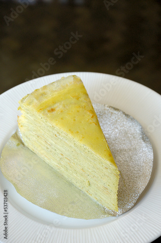 Vanilla crepe cake in white dish