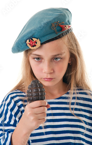 Portrait of the girl in the troop beret with a grenade in his ha
