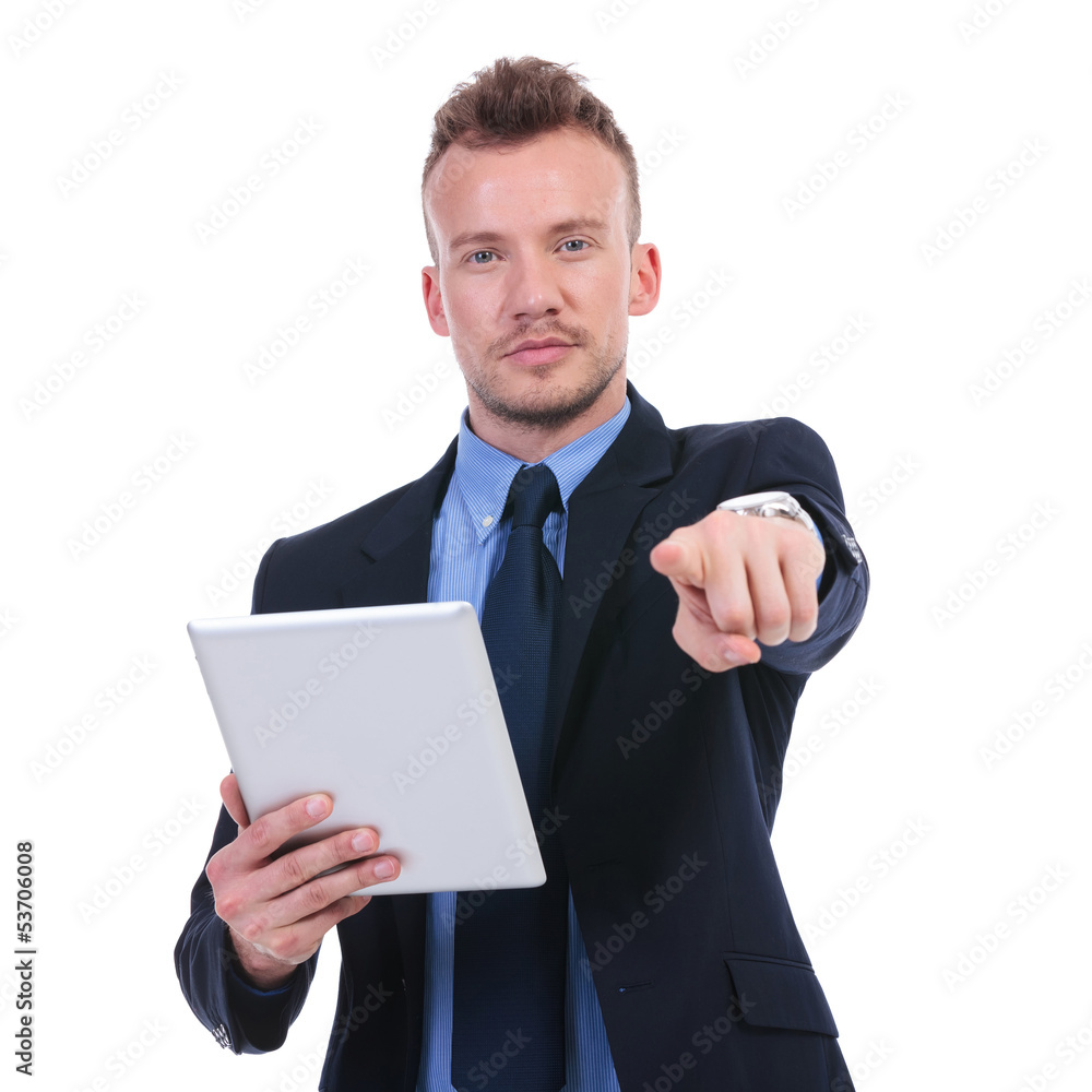 business man holds tablet and points at you business man holds tablet and points at you