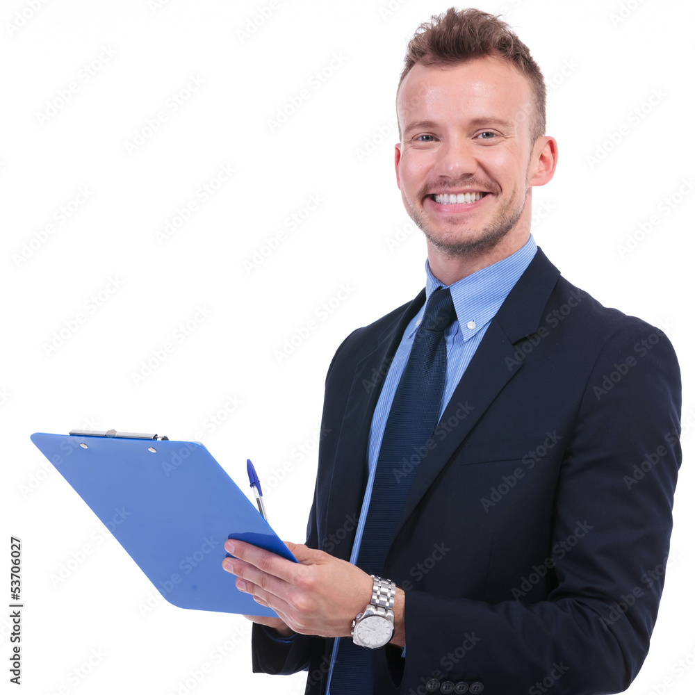business man smiles with pen and clipboard business man smiles with pen and clipboard