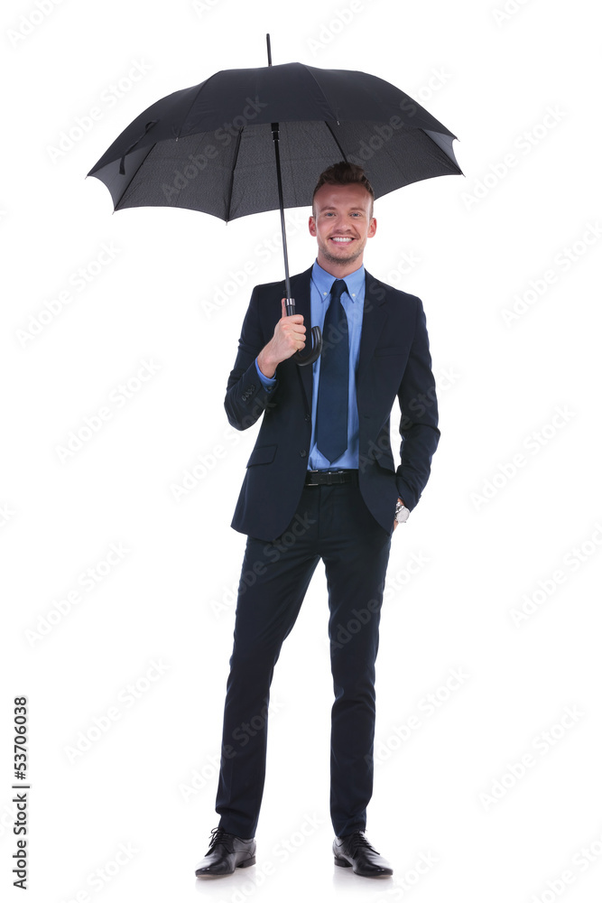 business man holds umbrella and hand in pocket business man holds umbrella and hand in pocket