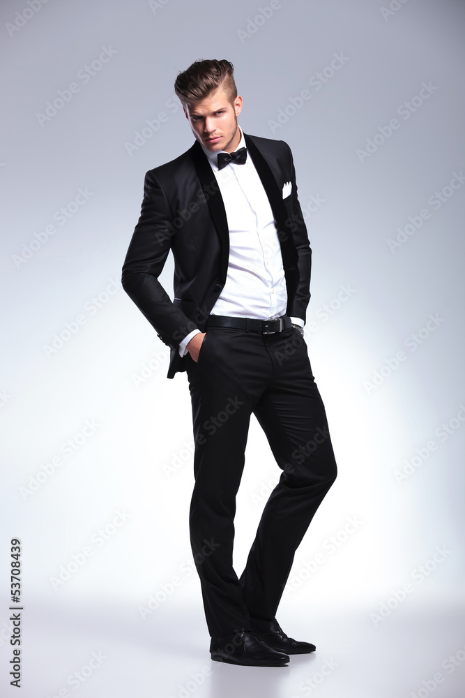 business man posing with hands in pockets business man posing with hands in pockets