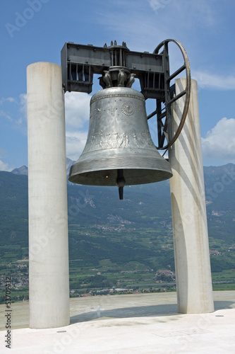 huge bronze Bell above the symbol of peace between peoples