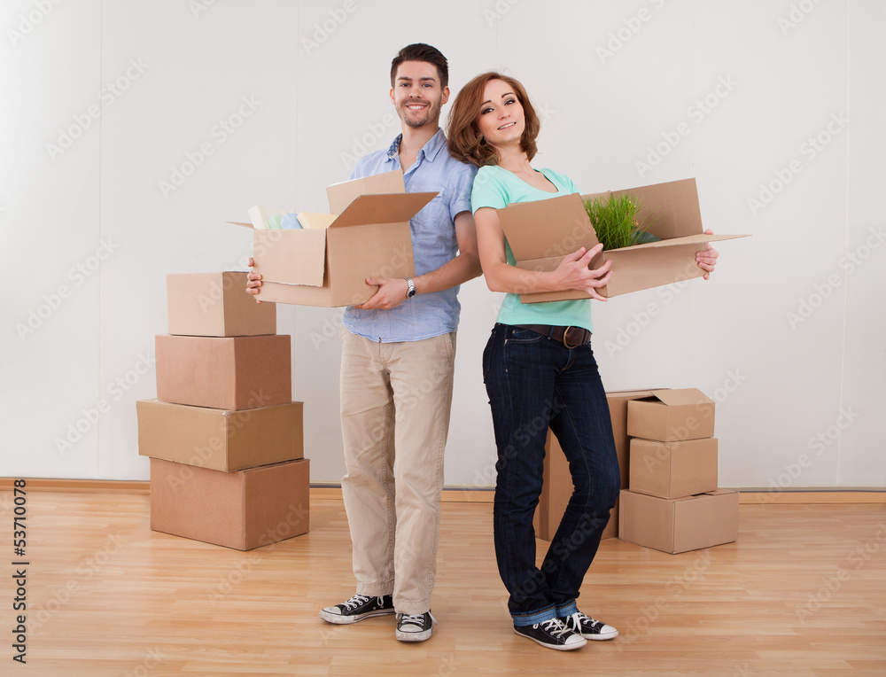 Young Couple Holding Cardbox Young Couple Holding Cardbox