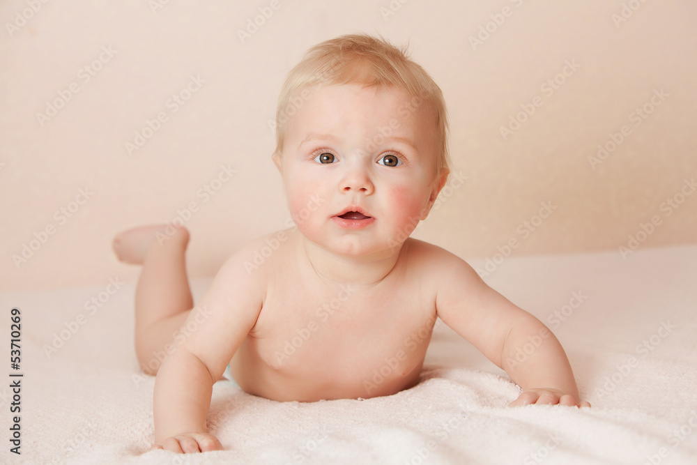 Caucasian baby boy joyfully smiles at camera Caucasian baby boy joyfully smiles at camera