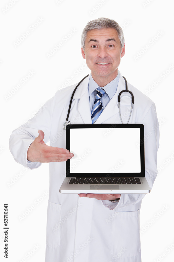 Portrait Of Male Doctor Showing Laptop Portrait Of Male Doctor Showing Laptop