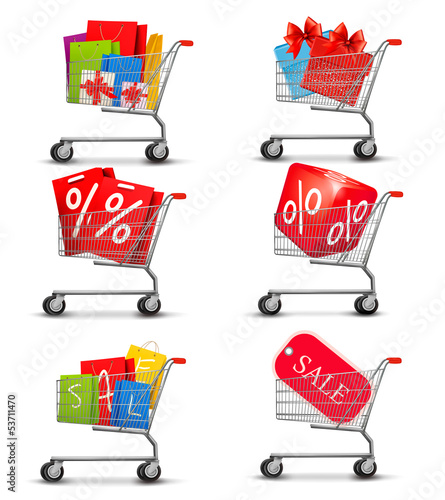 Group of shopping carts full of shopping bags and gift boxes. Co