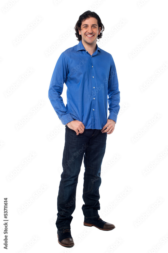 Fototapeta premium Full length shot of a smiling young man