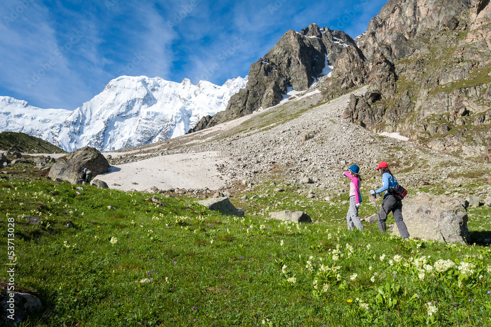 Fototapeta premium Hikier is climbing mountain in Caucasus mountains in Bezengi reg