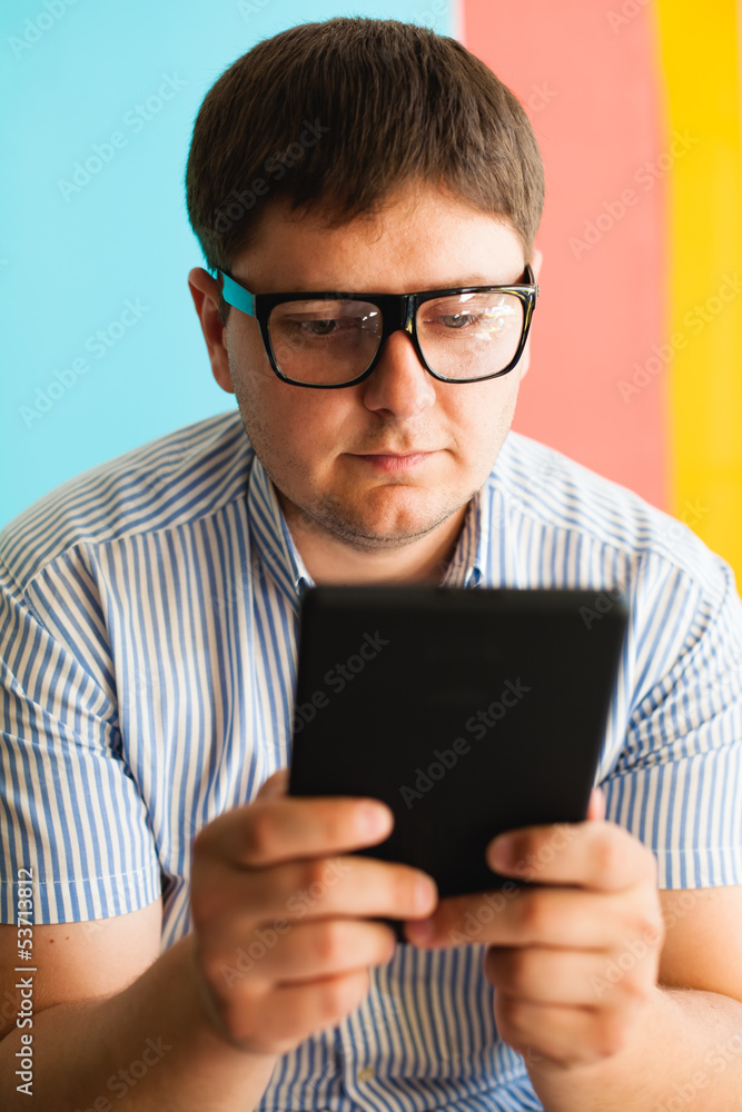 man uses a digital tablet
