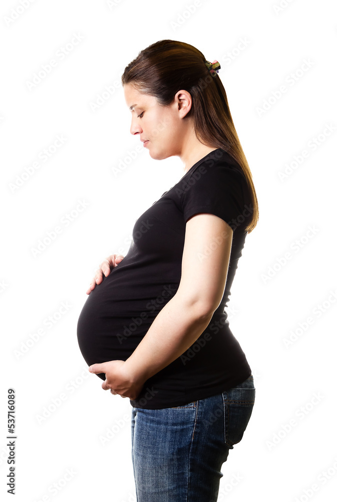 Beautiful expectant pregnant looking her belly isolated Beautiful expectant pregnant looking her belly isolated