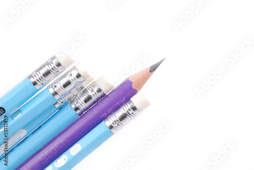 Blue pencils and one purple standing out.