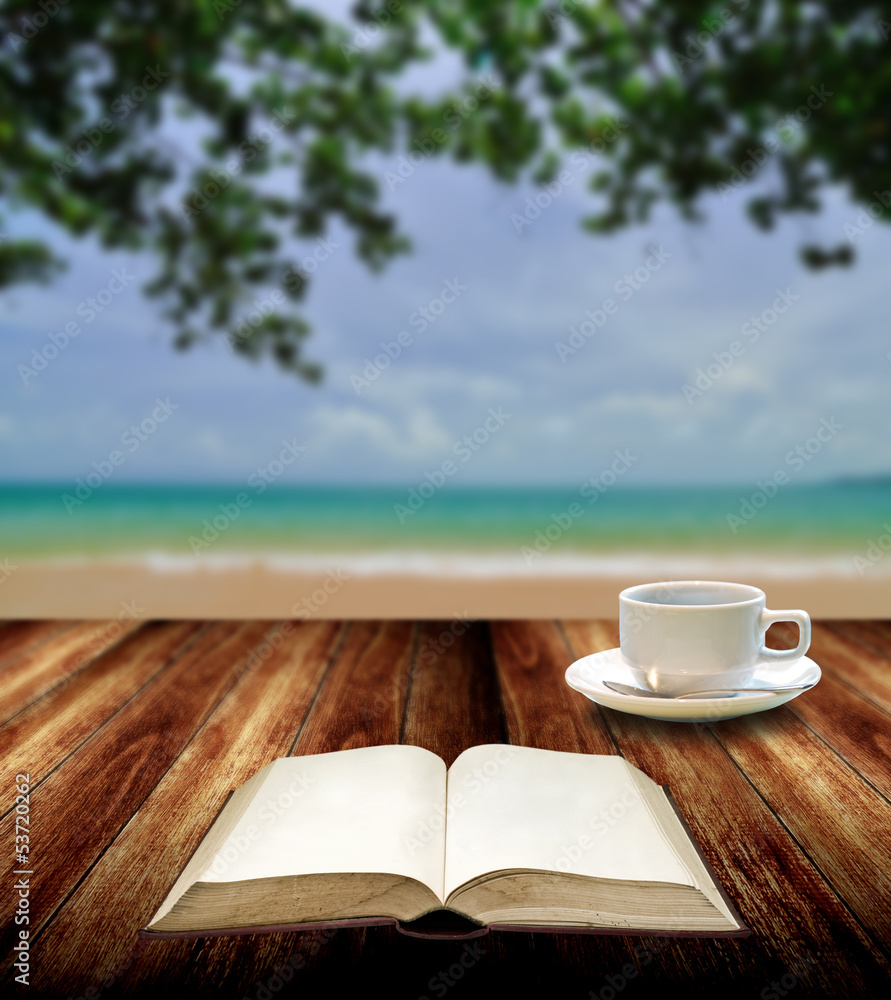 Reading book with hot cup at island , Relax concept Reading book with hot cup at island , Relax concept