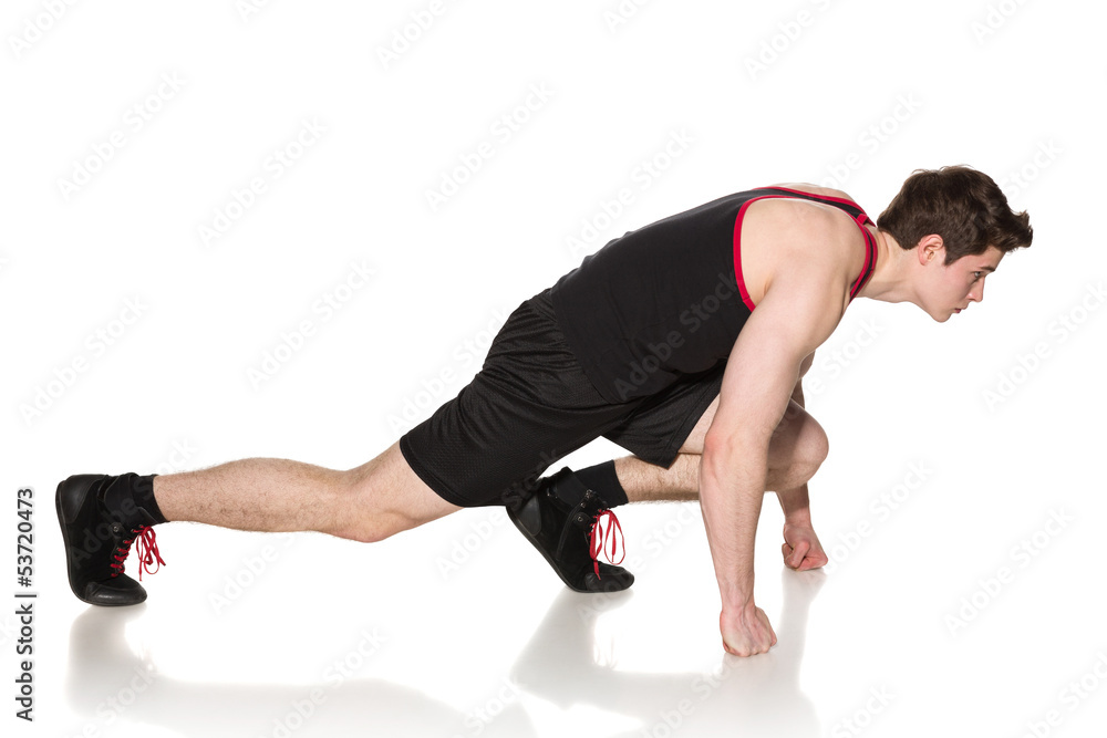 Side view of a male in start position Side view of a male in start position