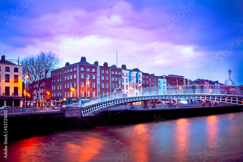 Dublin Ireland at dusk with waterfront and Ha'penny Bridge