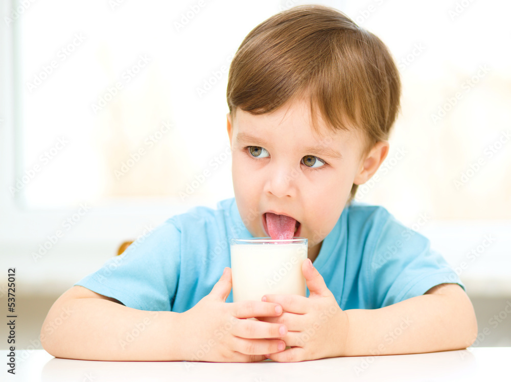 Cute little boy with a glass of milk Cute little boy with a glass of milk