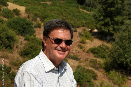 Portrait of a smiling  men in sunglasses in the country