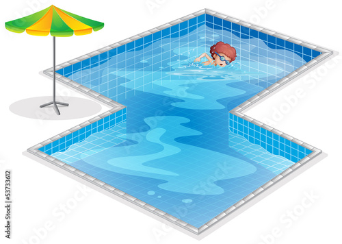 A boy practicing at the swimming pool