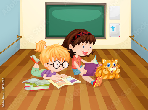Two girls reading books inside a room