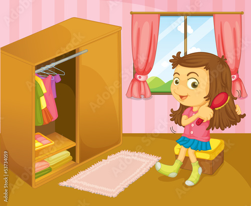A girl brushing her hair inside her room