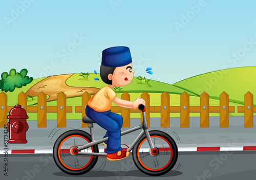 A sweaty muslim riding on a bike