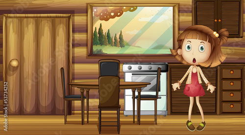 A shocked girl at the kitchen