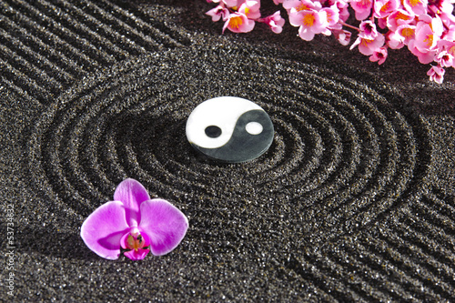 Japanese zen garden with yin and yang photo