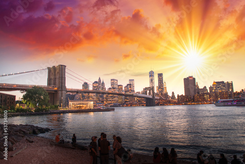 New York City. Wonderful sunset view of Brooklyn Bridge and Manh photo