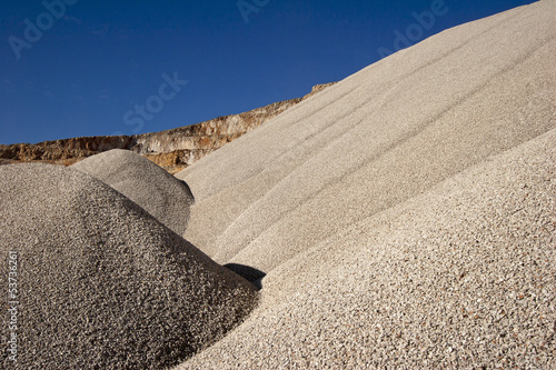 Heaps of aggregate in a rock quarry near Split in croatia photo