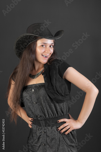 cheerful girl in a black hat © Maslov Dmitry