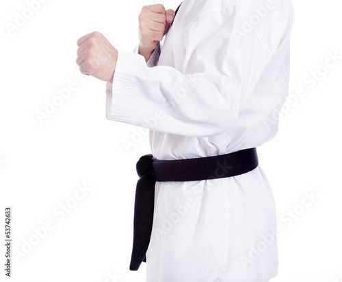 Black belt man practicing martial arts, isolated on white