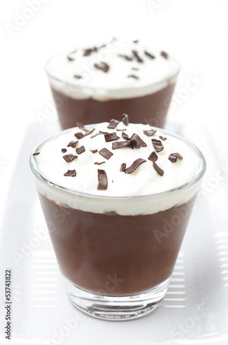 chocolate mousse with whipped cream on white background
