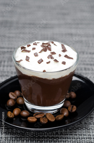 chocolate-coffee mousse with whipped cream in glass