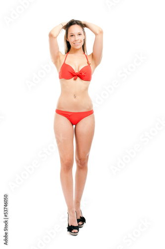 Full length woman in bikini isolated on white