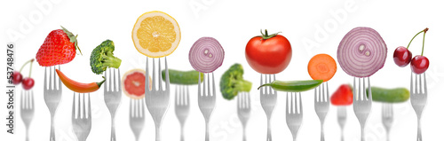 diet concept.vegetables and fruits on the collection of forks