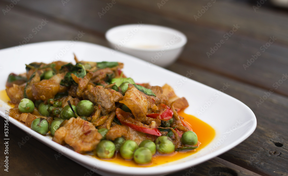 Thai food, Pork, Spicy Boar mixed with spices on plate Thai food, Pork, Spicy Boar mixed with spices on plate