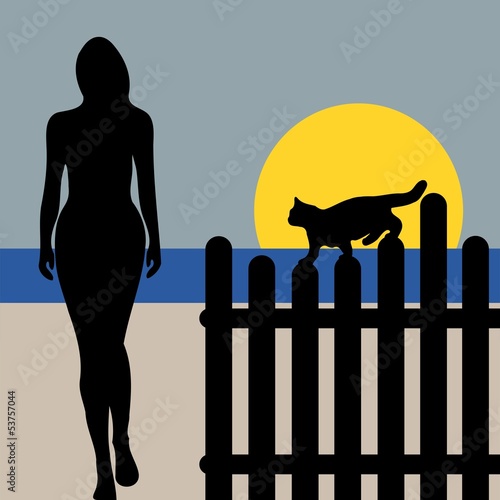 RAGAZZA CON GATTO TRAMONTO SULLA SPIAGGIA