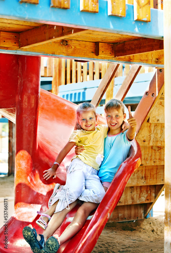 Children move out to slide in playground